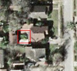 Bob the Lemon Tree as seen from space. Bob is evergreen in the Houston climate; this picture must have been taken in winter, because the big tree in the neighbor’s front yard (below mine in the photo) looks bare of leaves, but Bob is happy and green!